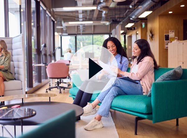 Women sitting together looking at charts